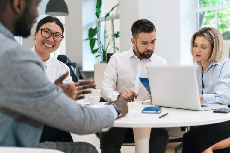 People talking business at small table
